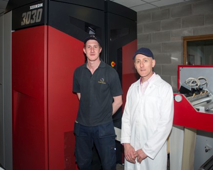 The new Xeikon 3030 machine with Stuart McCord, Xeikon Operator, left, and Keith Hamilton, Managing Director right