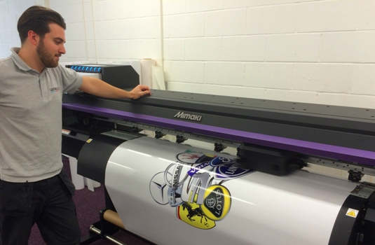 Lustalux's Sign & Graphics Assistant, Jonny Borg with the company's new Mimaki CJV300 printer/cutter